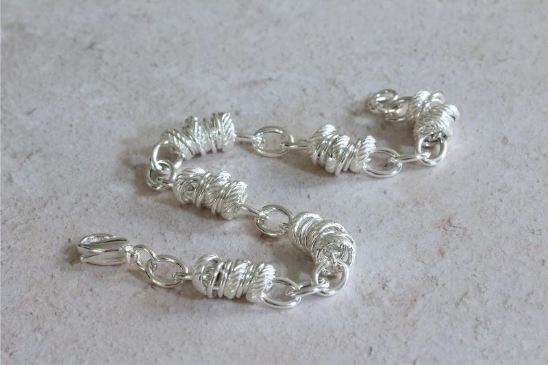 Silver Bracelet with Rings and Oval Links